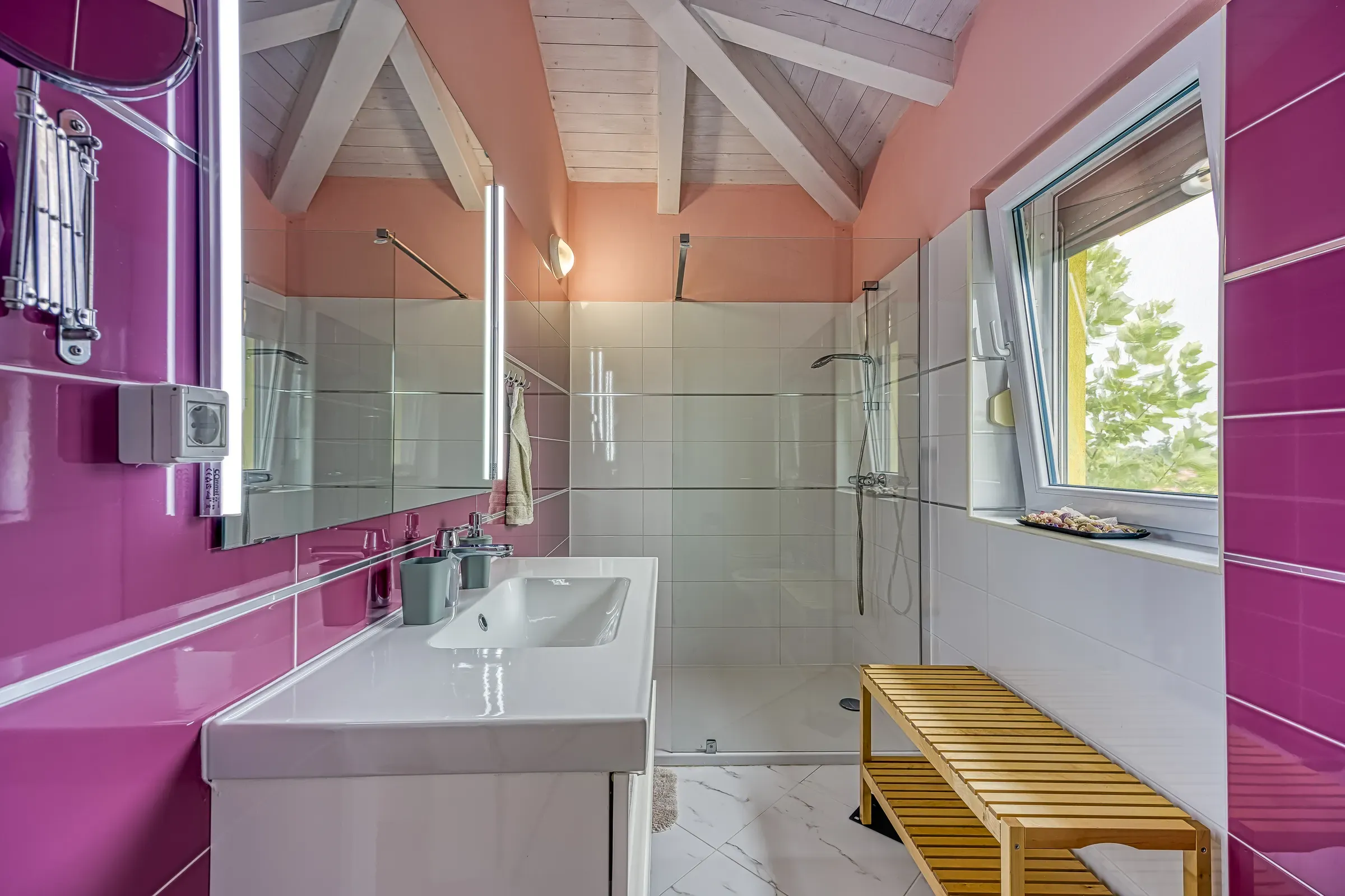 Striking magenta-tiled bathroom with a walk-in shower