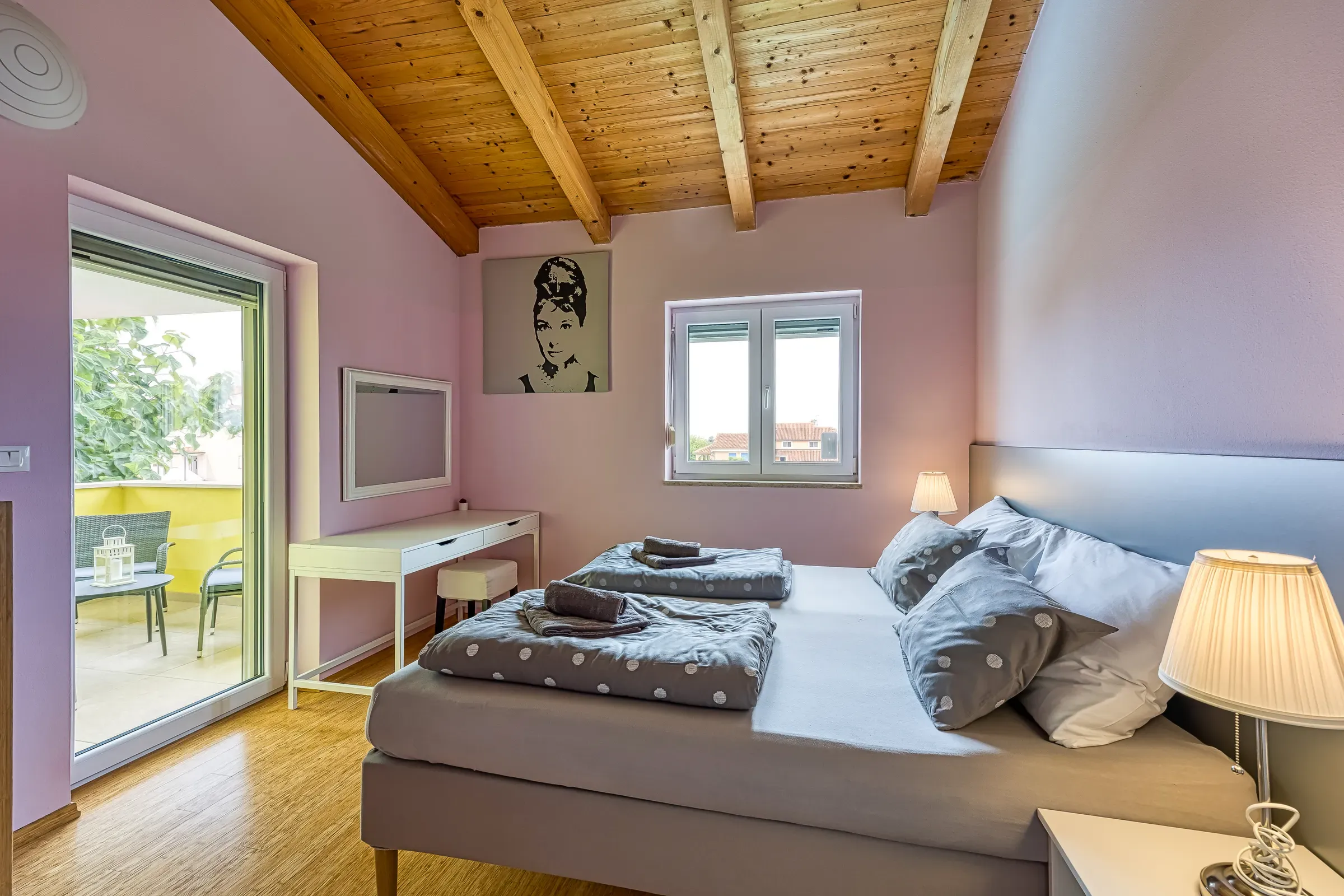 Attic double bedroom under exposed timber beams